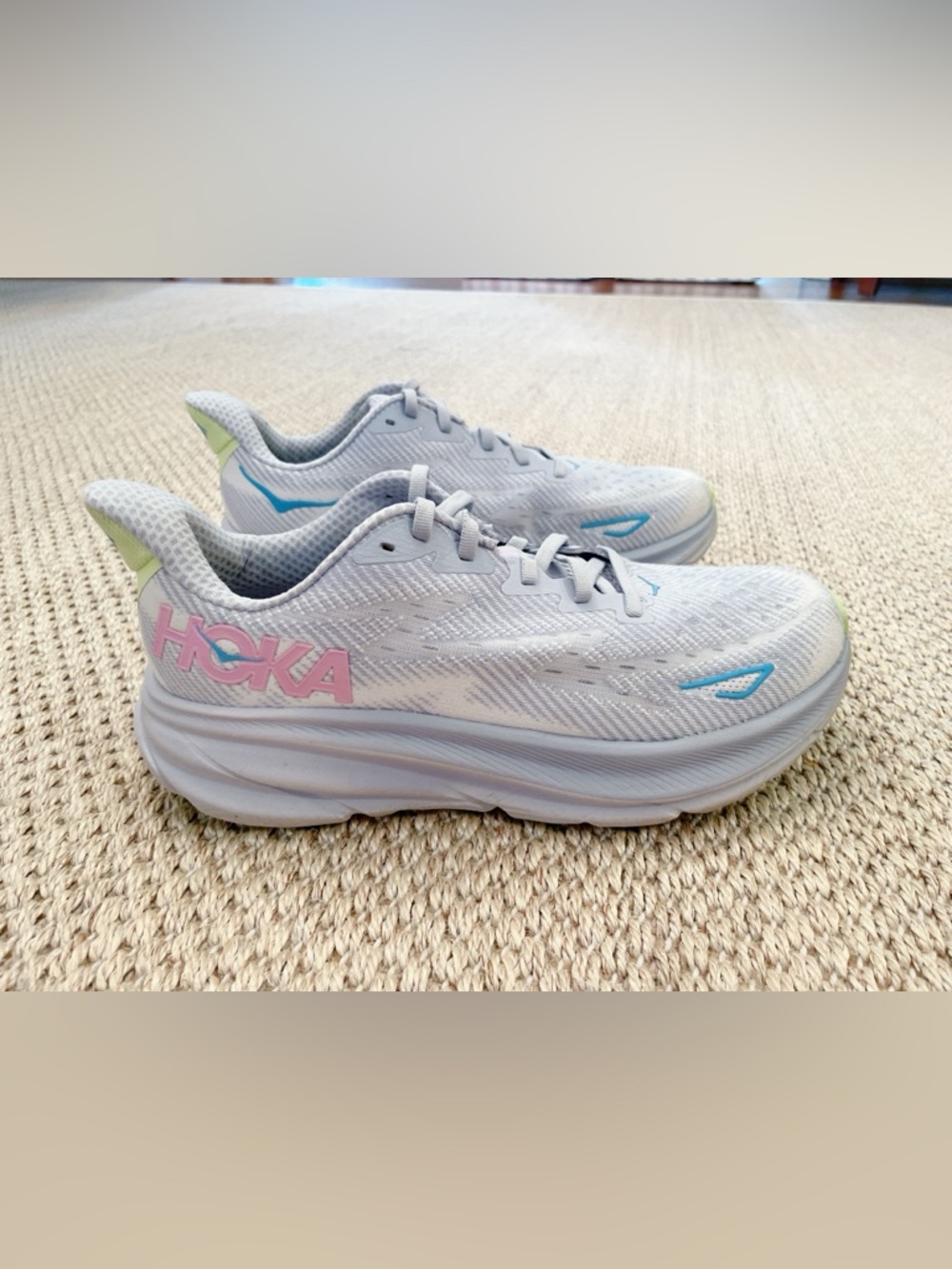 Hoka Women's Light Gray Running Shoes with Pink Logo and Blue Accents